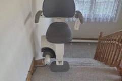 Flow X curved stair lift installed on a curved staircase