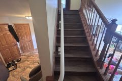 A Flow X curved stairlift by Access BDD installed in Hanover Park, IL on a curved staircase.